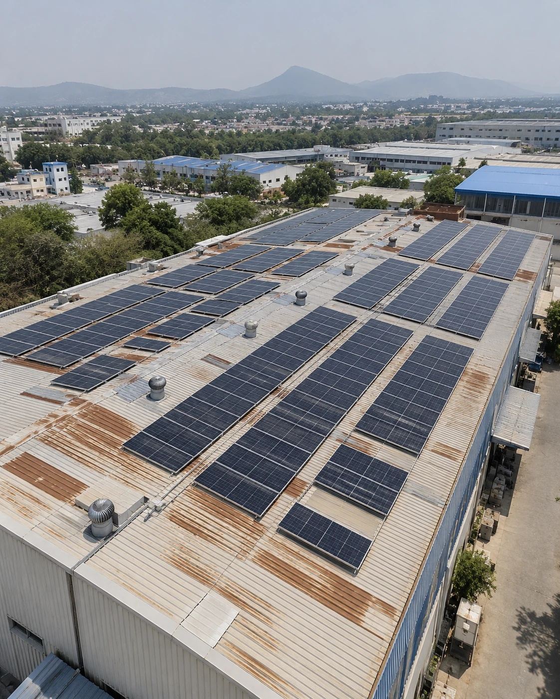 Solar panels installed on a large commercial warehouse roof